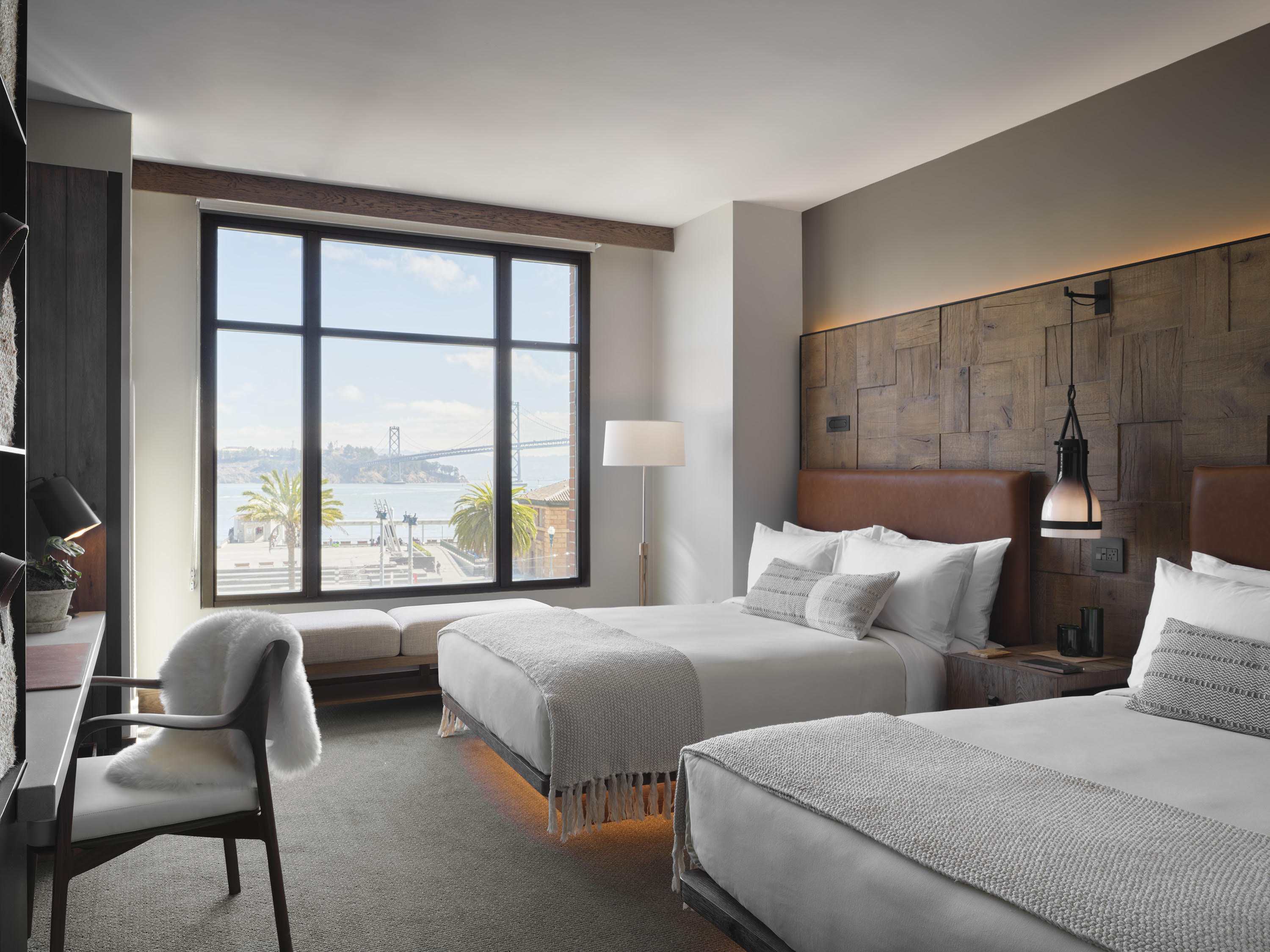 Two queen beds overlook the nearby waterfront