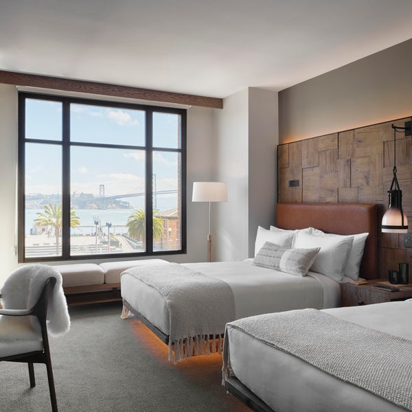 Two queen beds overlook the nearby waterfront
