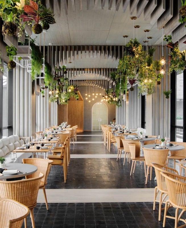 Dining hall area with chairs and booth seating