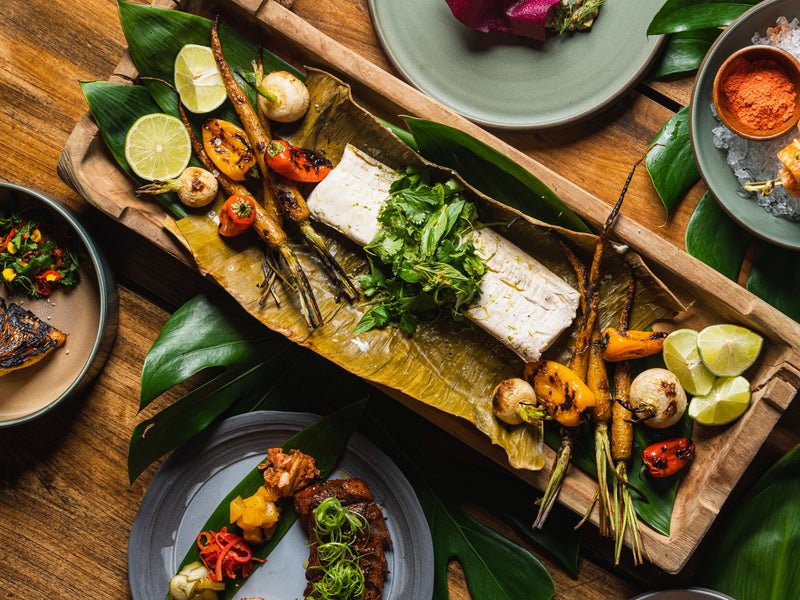 Charred vegetables on a board