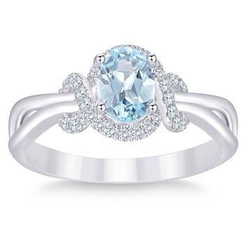 Oval Cut Blue Topaz and Diamond Ring (0.19 ctw)