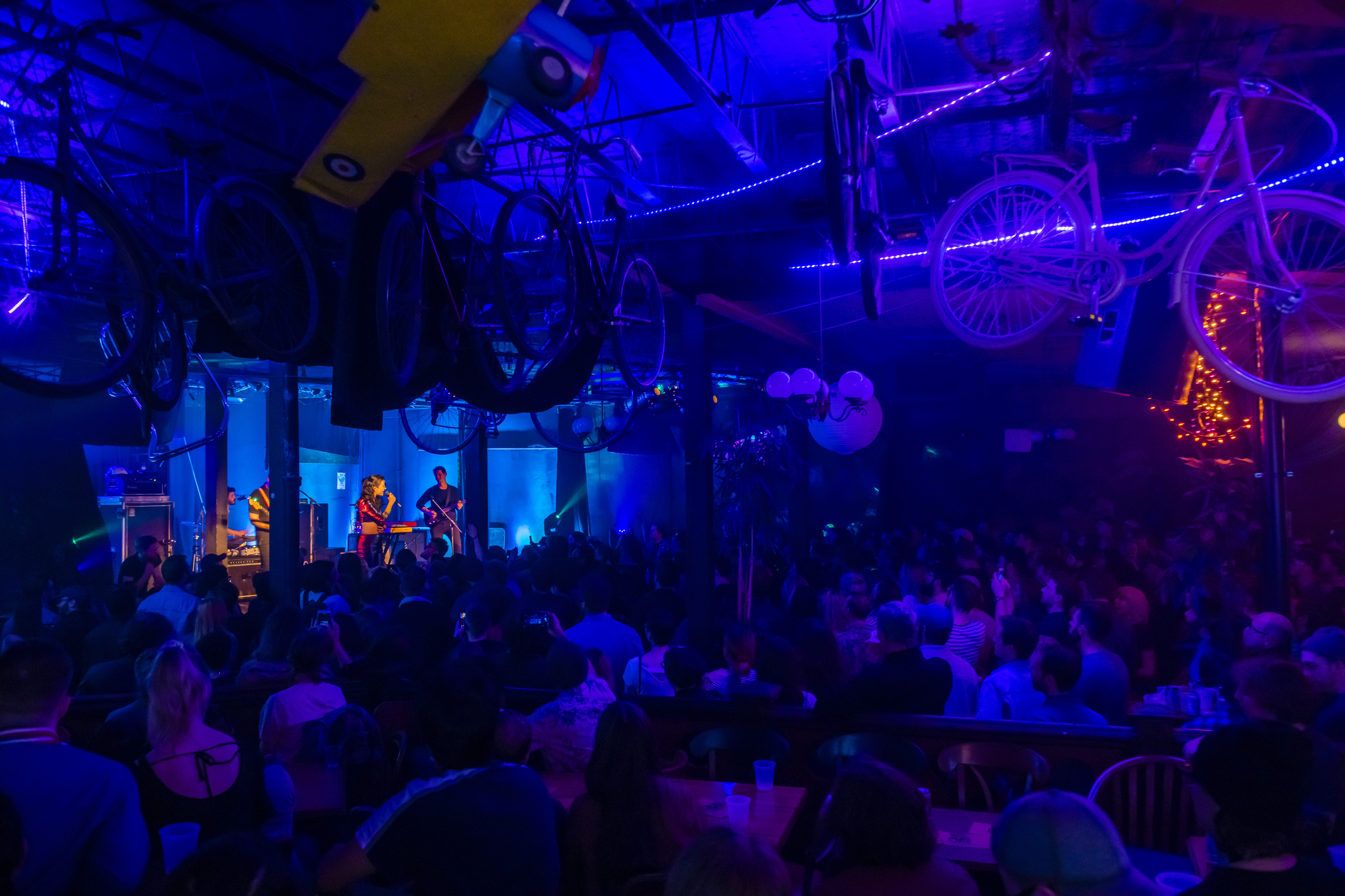 People at annual music conference and festival experience, Halifax Pop Explosion, in Halifax celebrating the city's music scene