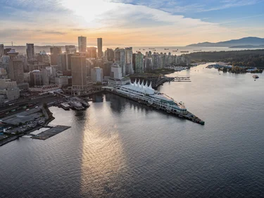 Aerial view of downtown Vancouver and Canada Place facing west at sunset