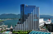 Fairmont Waterfront hotel in Vancouver, ocean and mountains in the distance