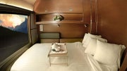Prestige luxury train cabin with double bed facing a window