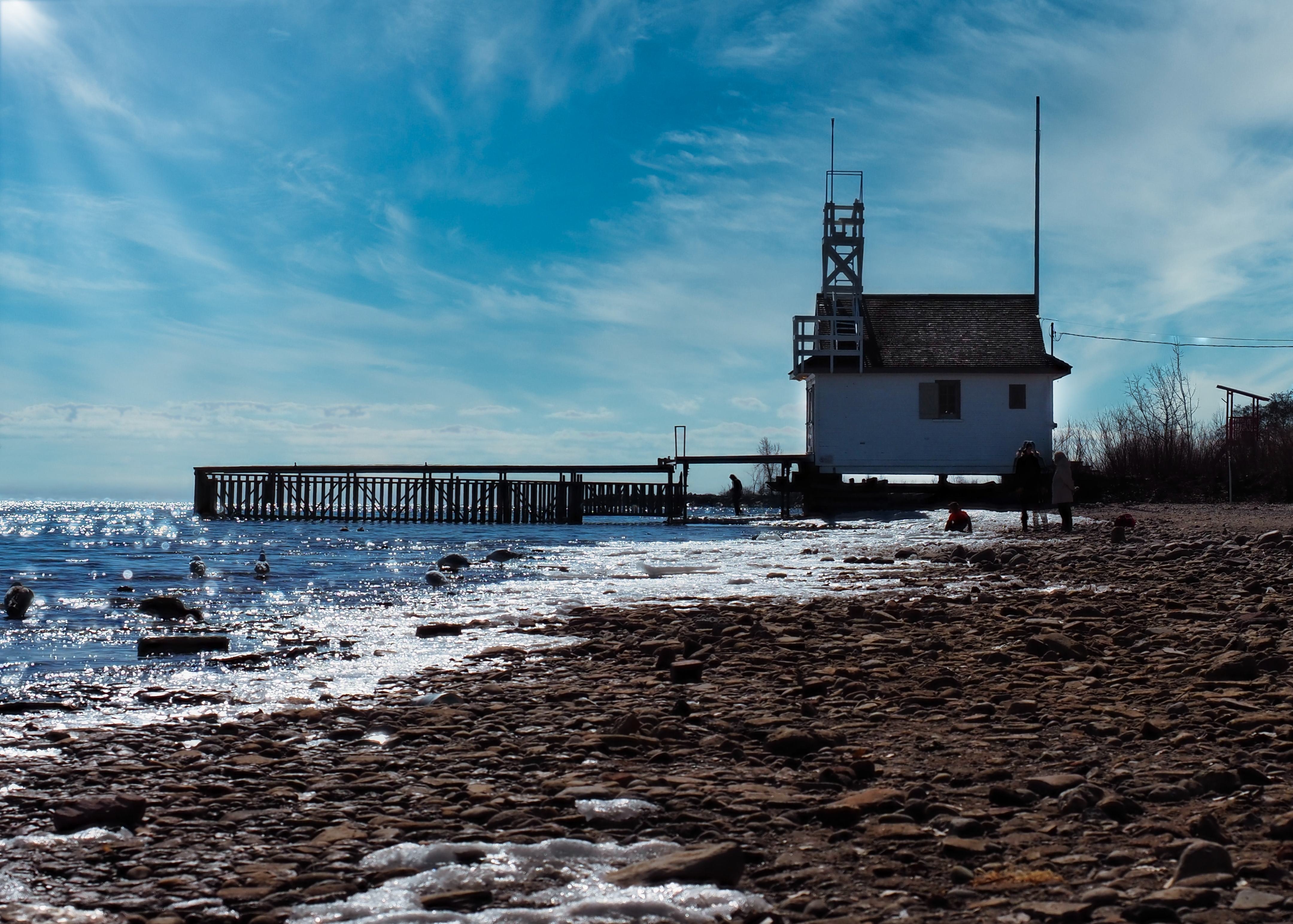 White lifeguard house on a pebble beach