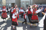 A group dance in the street in traditional Portuguese outfits