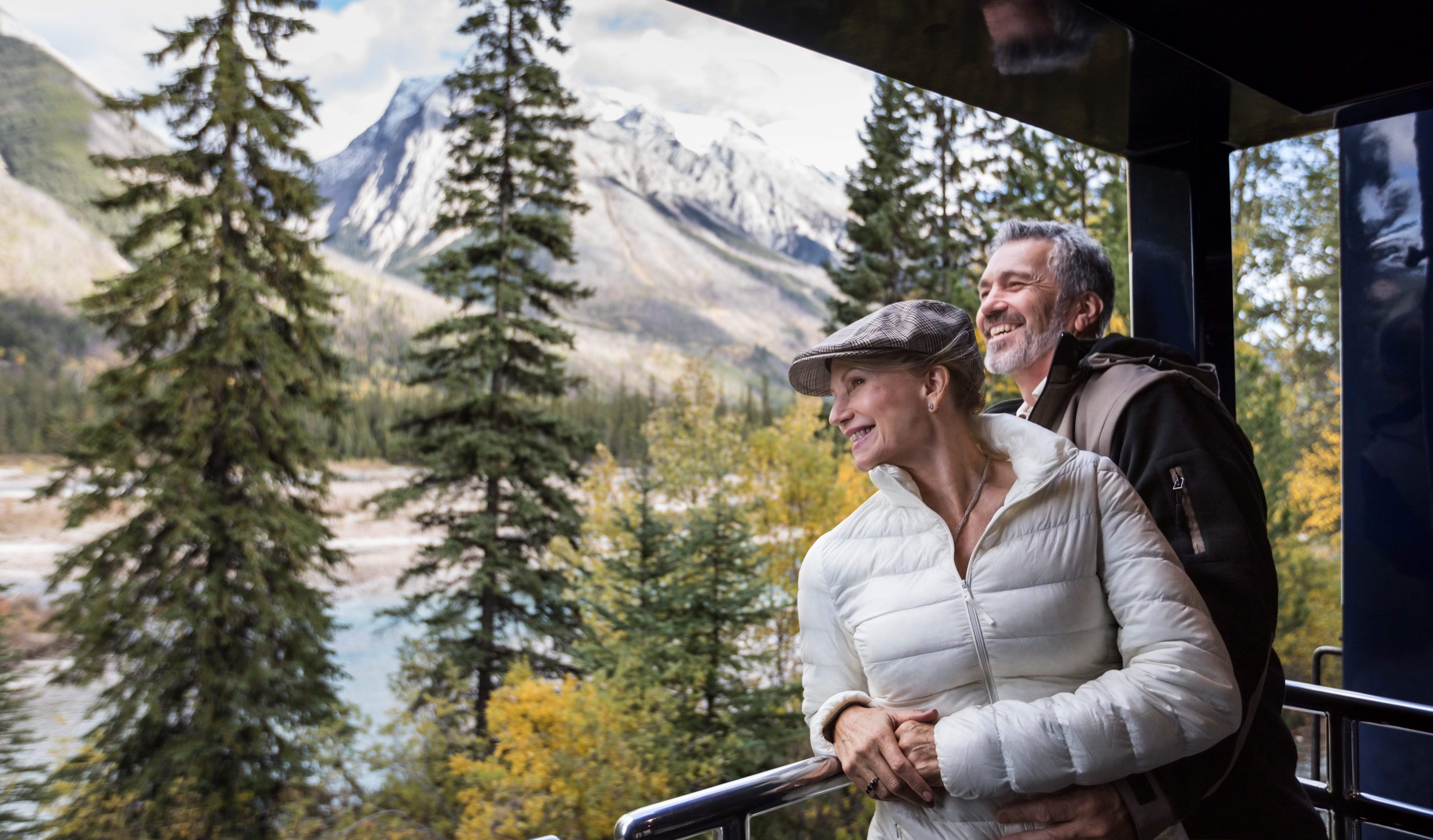 Couple enjoys the view from the GoldLeaf service outdoor viewing platform.