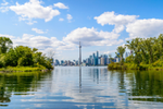View of CN Tower and cityscape from Toronto Islands and across water