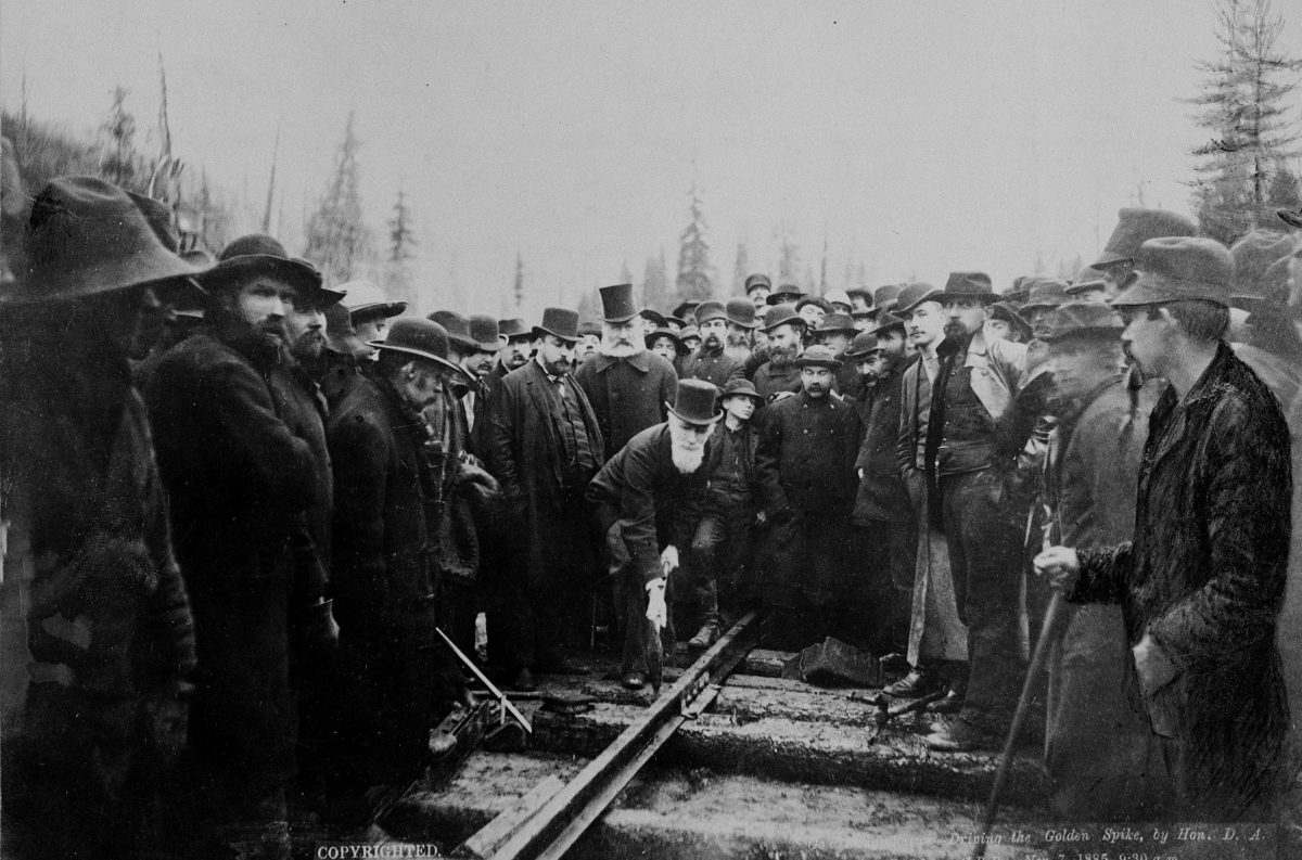 The last spike is driven into the Canadian Pacific Railway