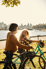 A mother and daughter bike the seawall in Stanley Park in Vancouver.