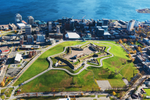 An aerial view of star-shaped Citadel Hill National Park and the core of downtown Halifax next to the ocean