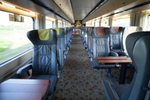 Business class seats with small tables in VIA Rail’s Corridor Train