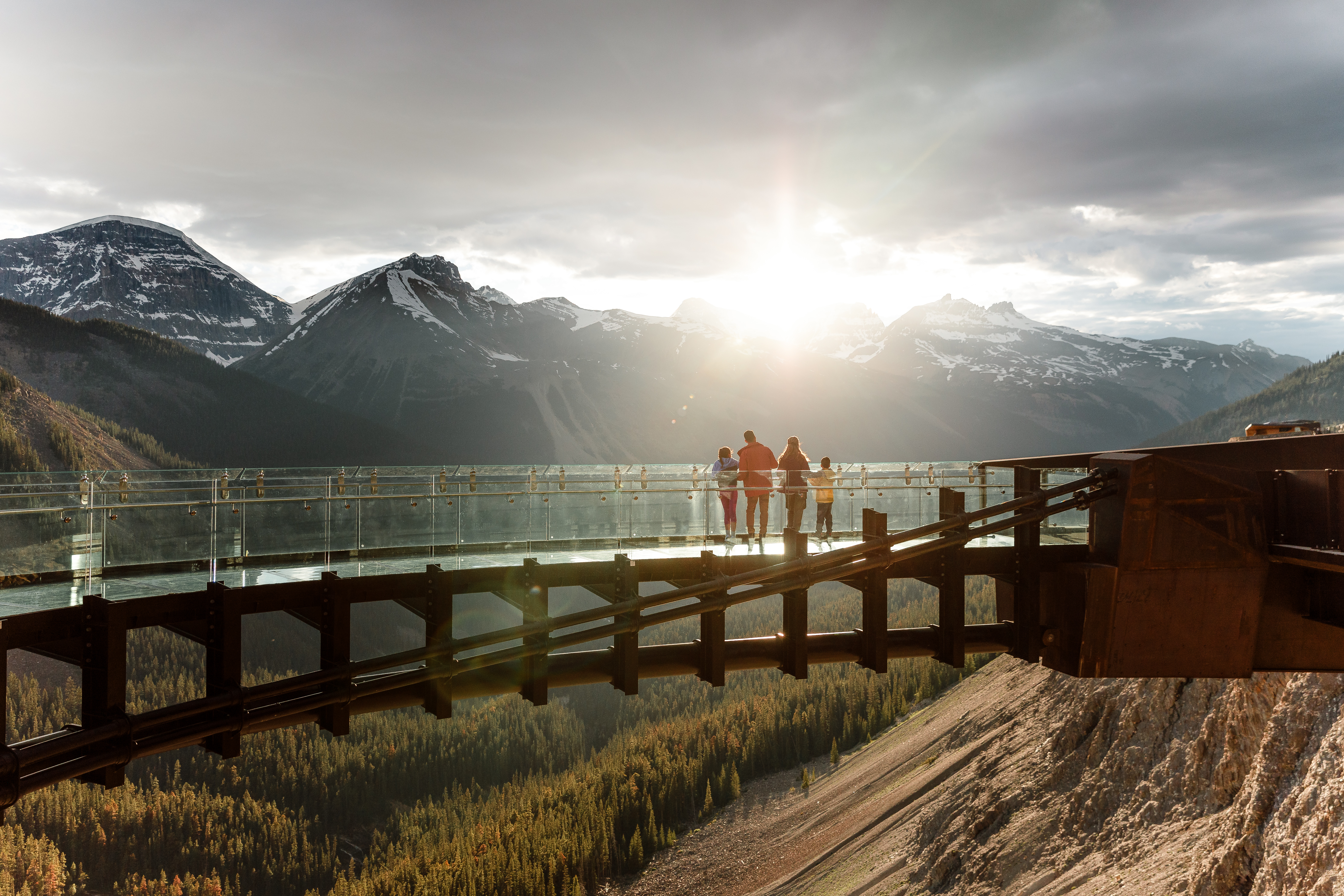 People standing on the Columbia Icefield Skywalk looking out at the mountains