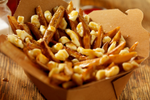 Classic poutine in cardboard take away box