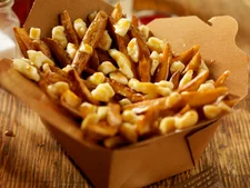 Classic poutine in cardboard take away box