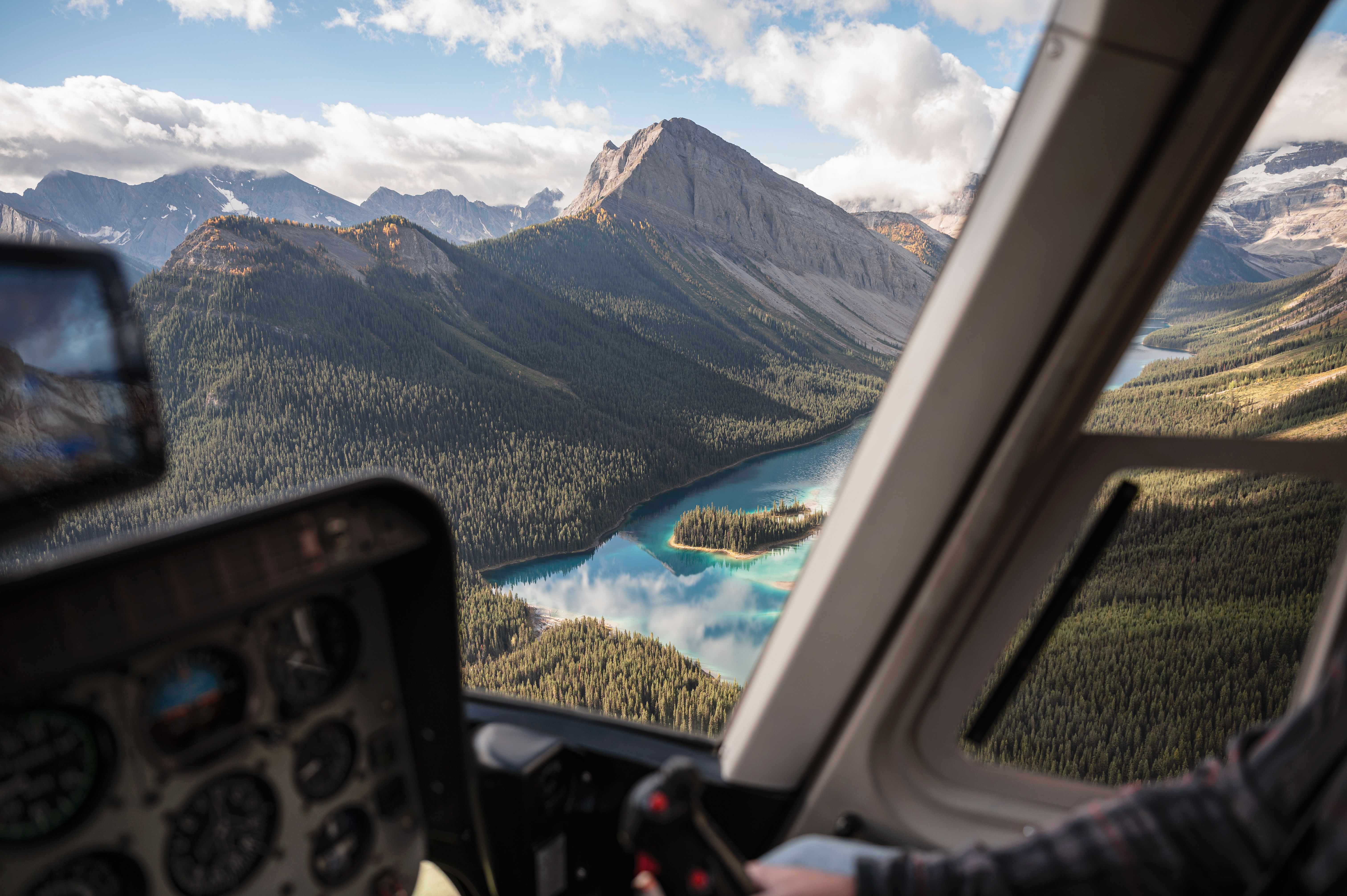 Inside of helicopter flying over the Rocky Mountains