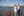 Couple stands on the deck of a boat and drinks wine as they cruise down the St. Lawrence River 