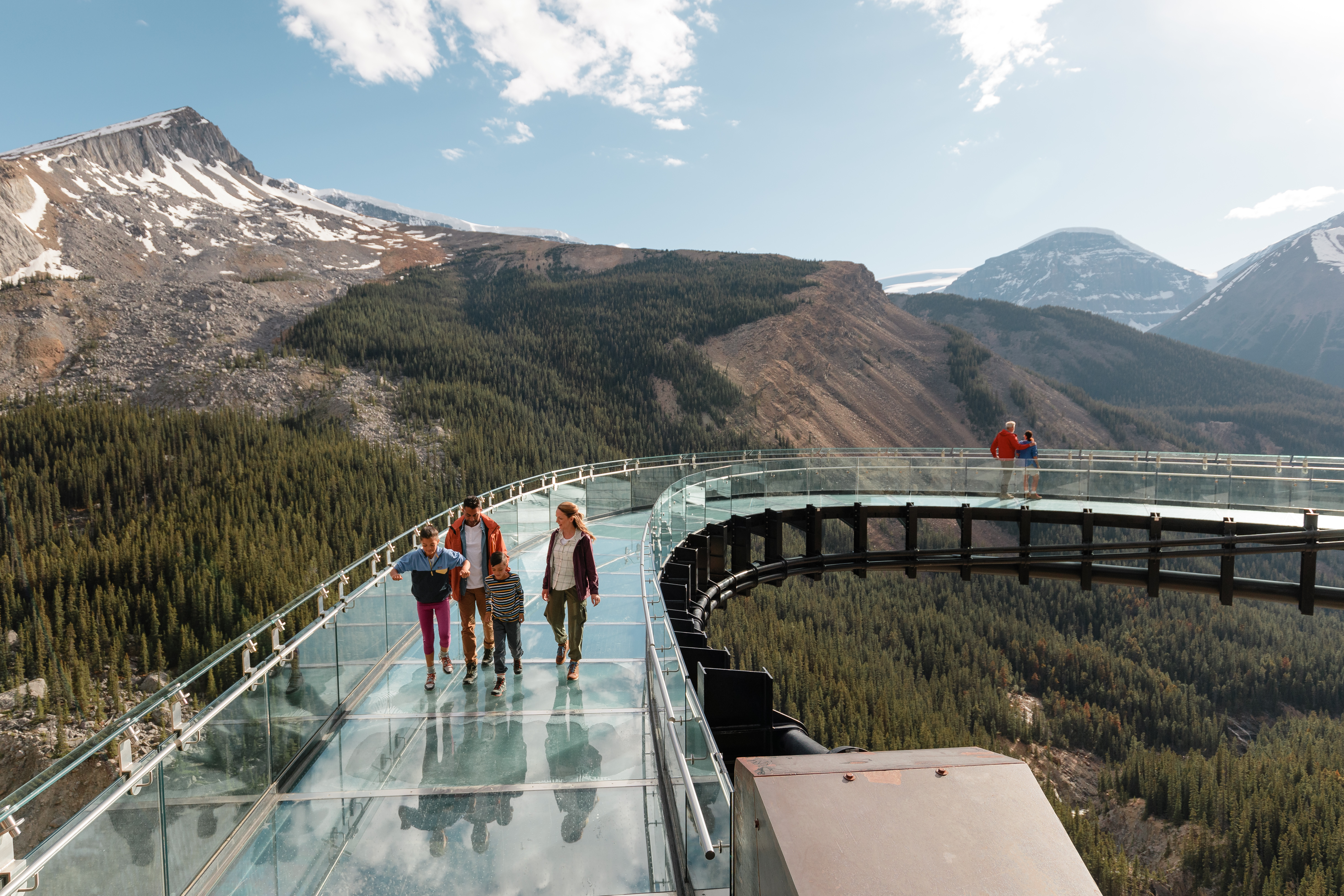 A family makes their way along the Glacier Skywalk