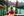 Woman with Canada flag wrapped around her overlooking Moraine Lake