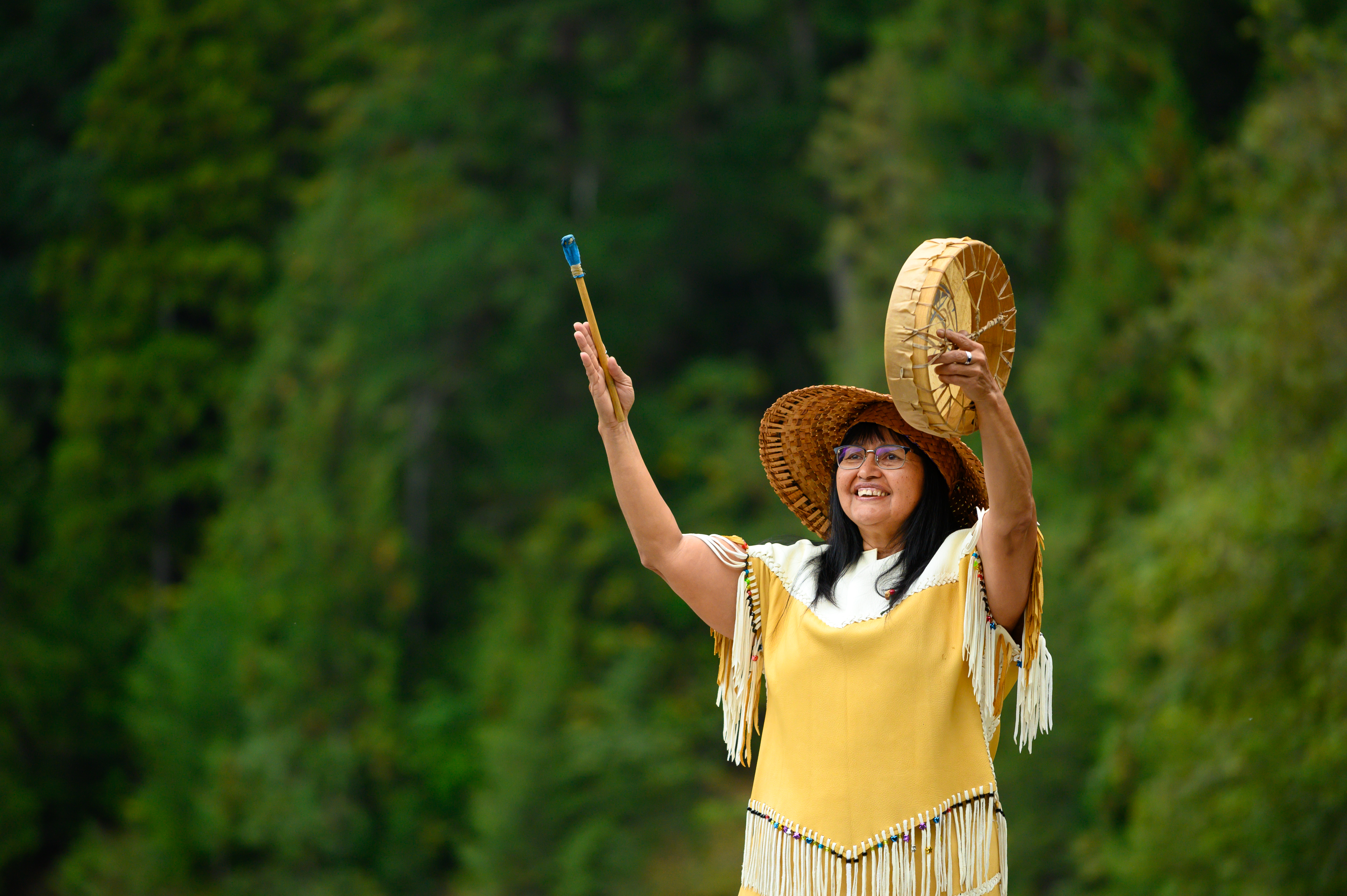 Indigenous woman performing a traditional welcome song