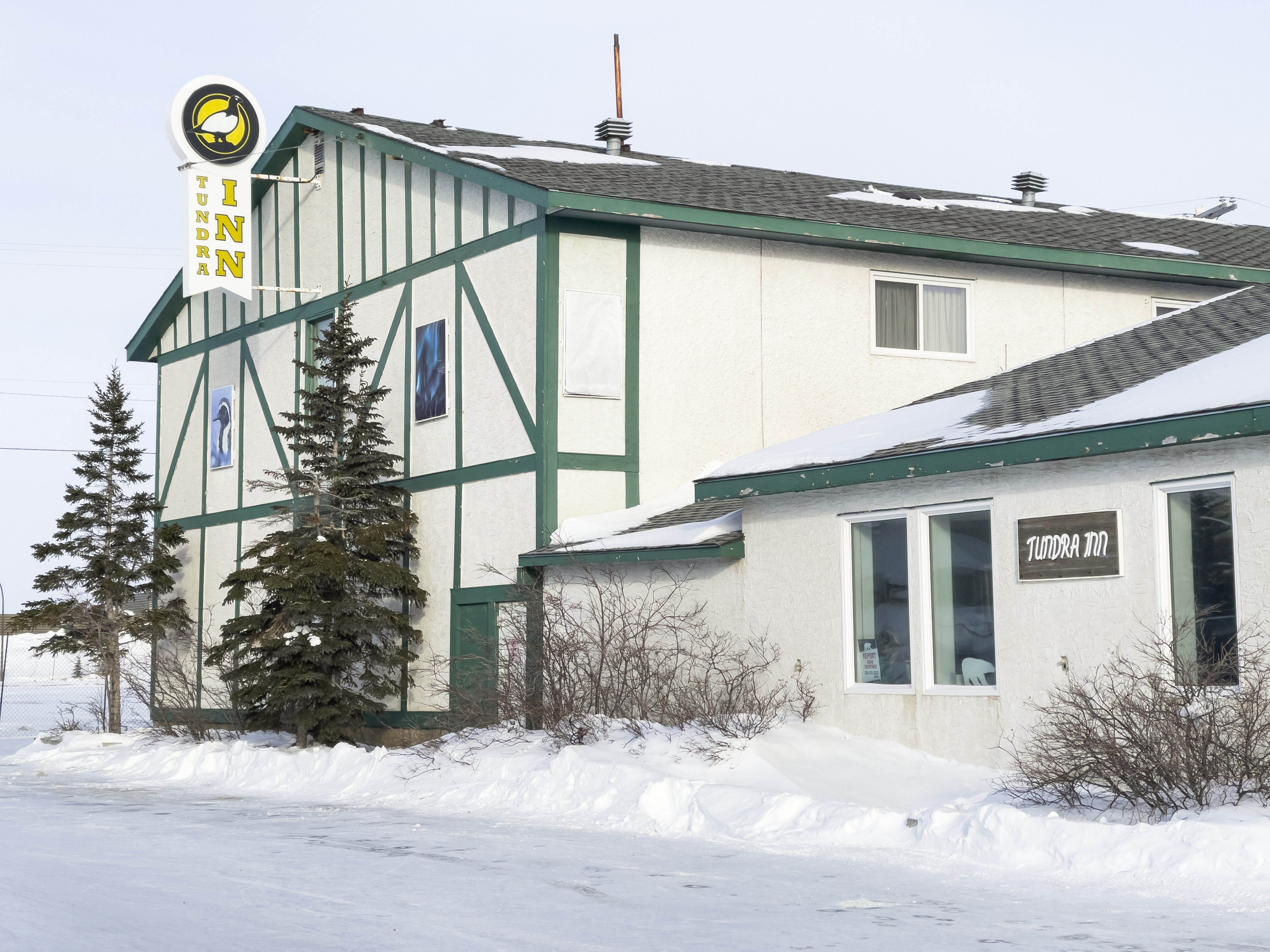 Exterior of the Tundra Inn hotel after snow in coastal town of Churchill, Manitoba