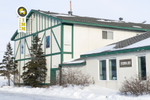 Exterior of the Tundra Inn hotel after snow in coastal town of Churchill, Manitoba
