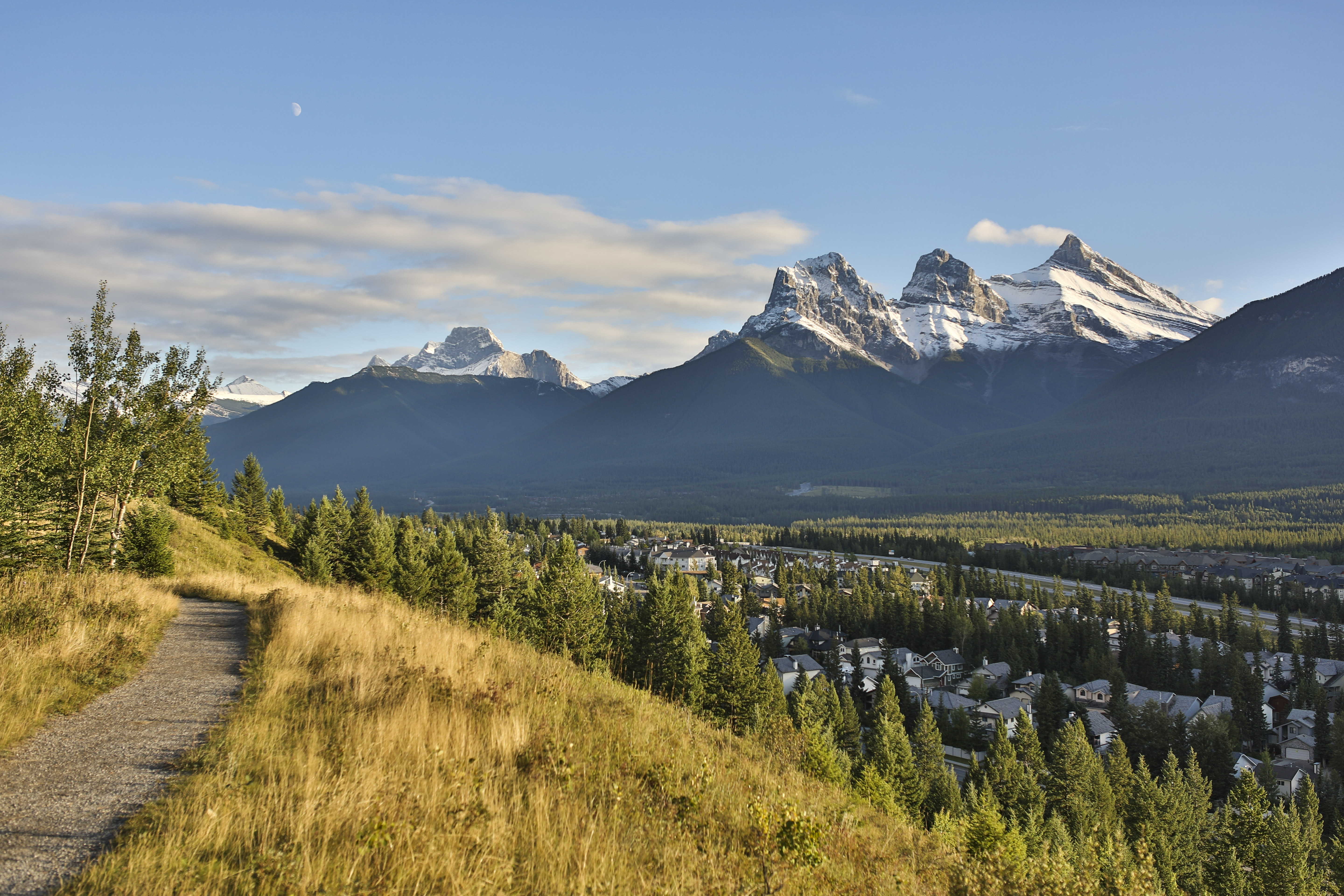 Flat path with view of snowcapped Three Sisters mountains in Canmore