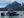 Boat on a lake surrounded by mountains.