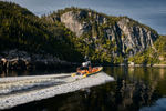 A zodiac boat cruising through the Saguenay Fjord in Quebec