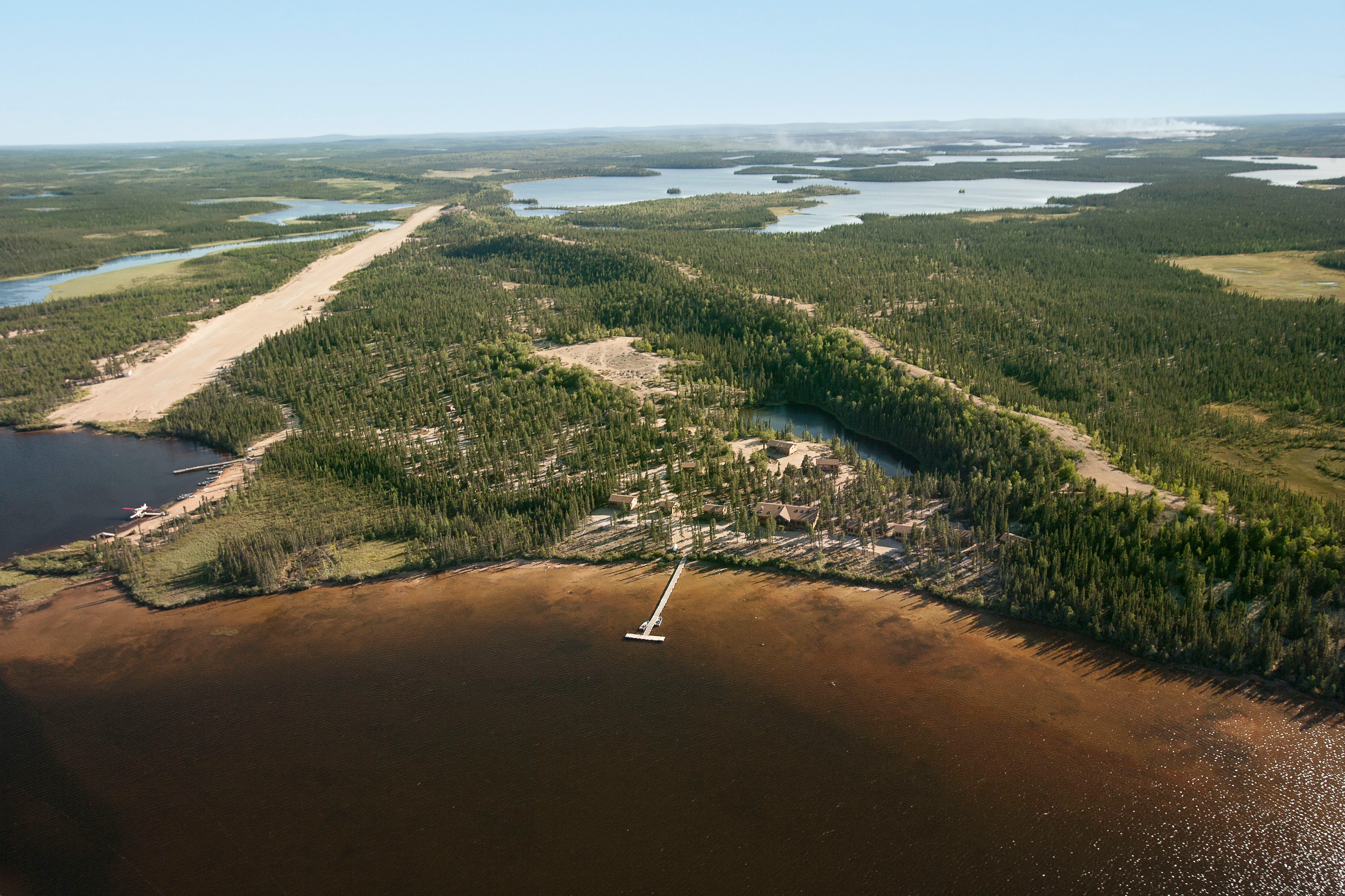 An aerial view of a large body of water surrounded by trees