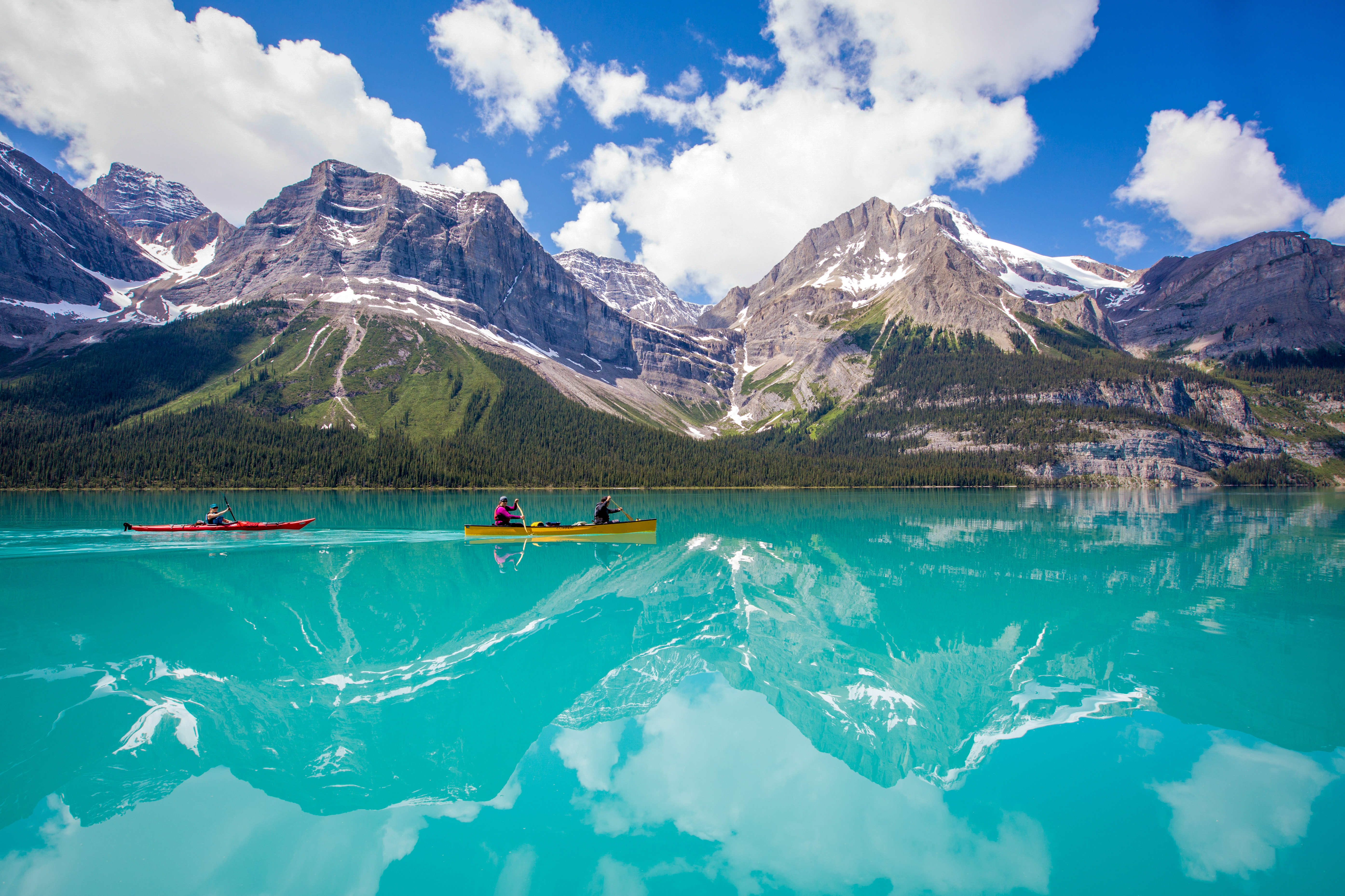 Two canoes on the turquoise blue water of Maligne Lake in Jasper National park