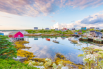 Colourful houses and small boats by the coast