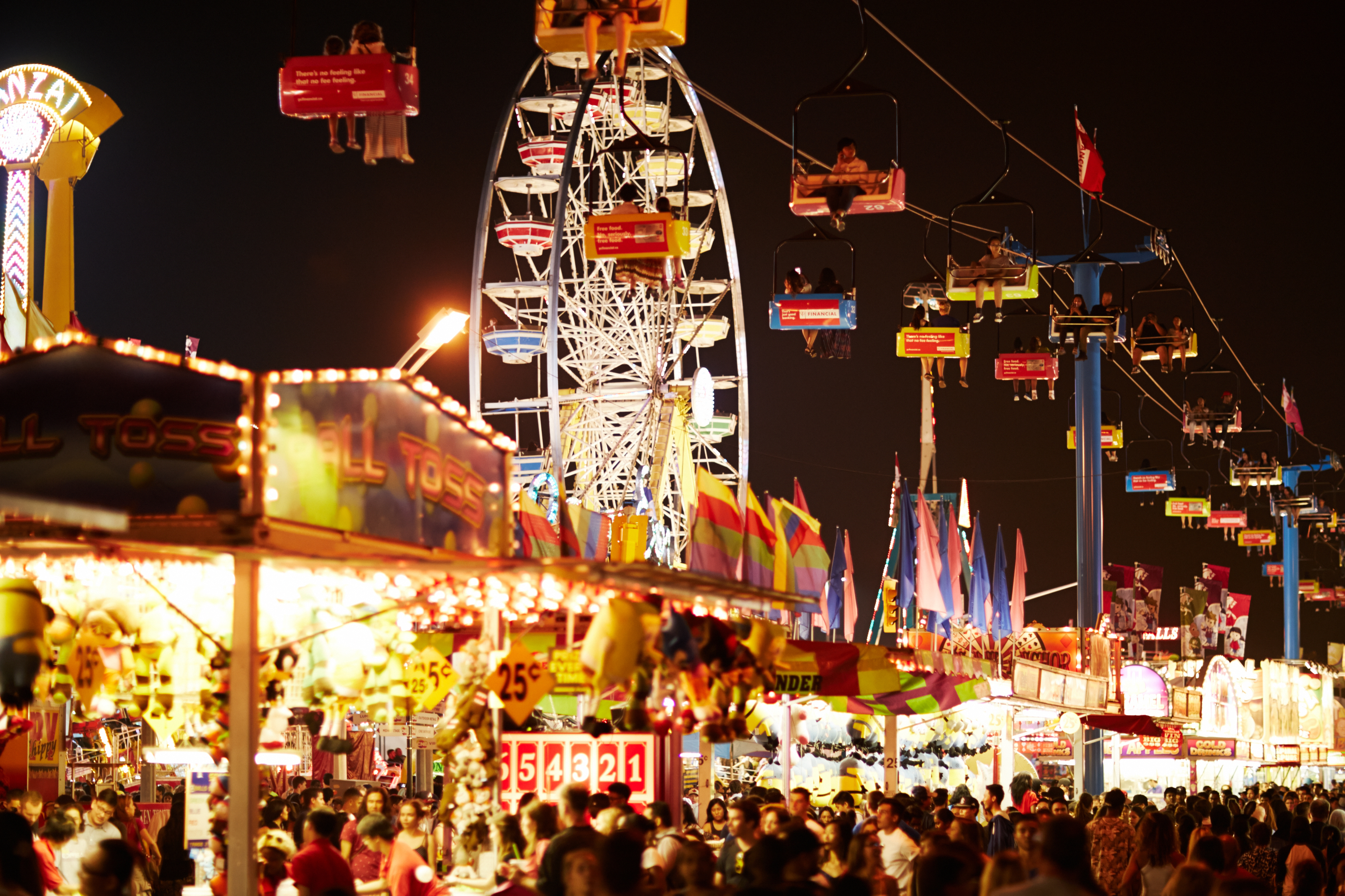 The amusement rides and game stalls of the Canadian National Exhibition at night