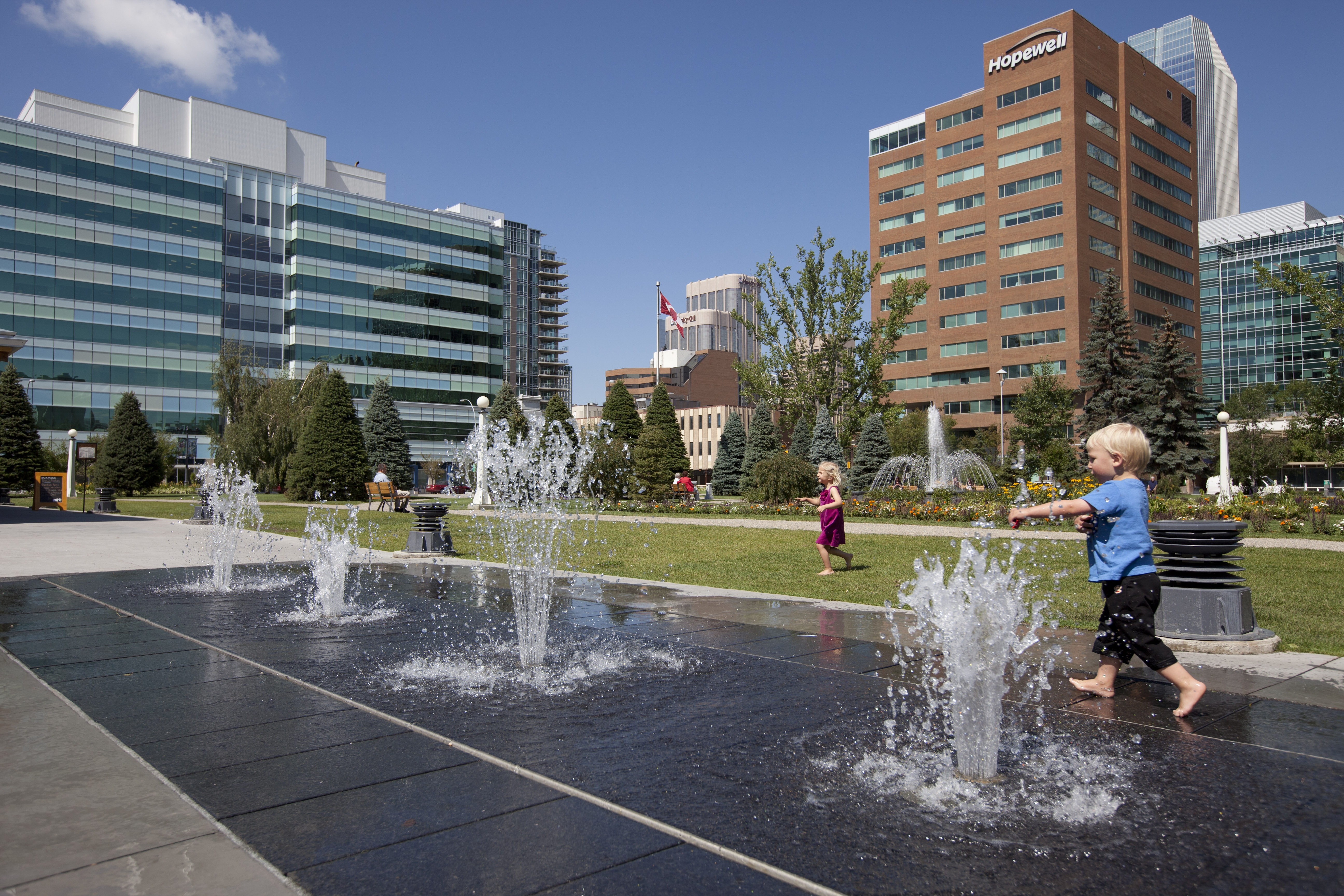 Children play with water in Central Memorial Park and near fountain