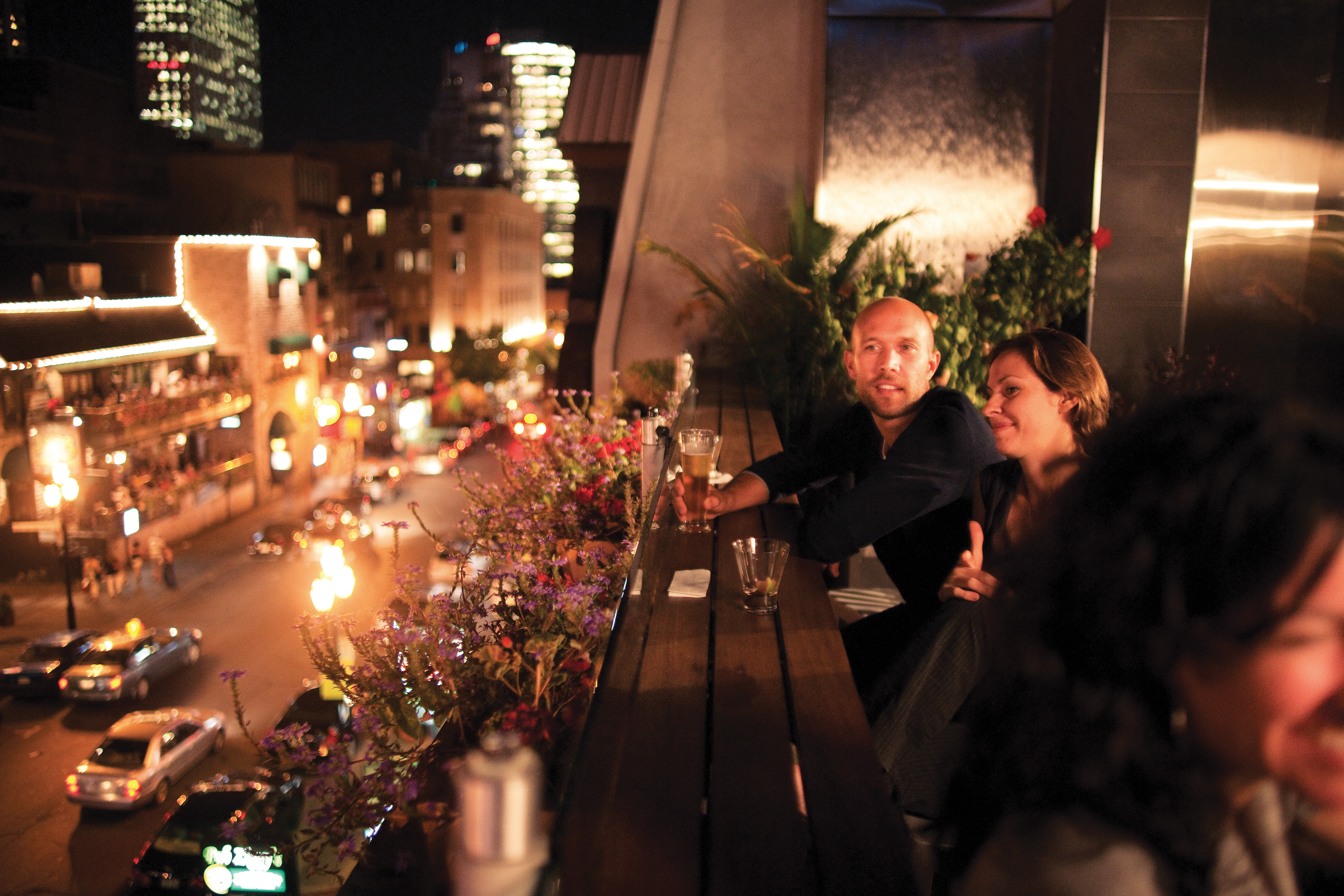 Couple enjoying a drink on Crescent Street in Montreal