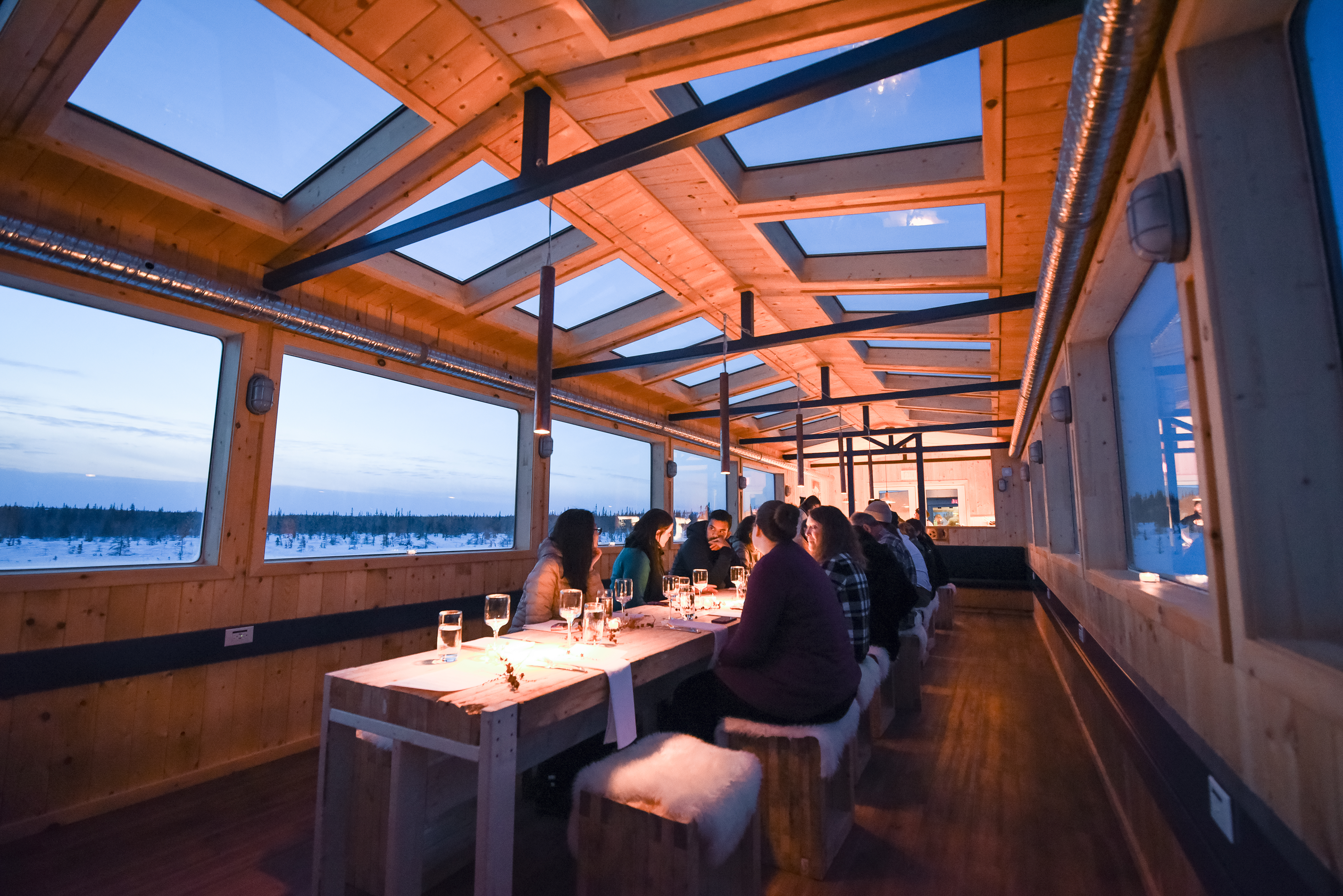 Journey by official Tundra Buggy across the frozen Churchill River to Dan’s Diner and experience regional cuisine in a pop-up restaurant, complete with skylights and panoramic windows for best northern lights-viewing opportunities