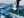 A man and a woman are kneeling on a piece of ice road in Yellowknife