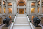 Grand staircase and two bison sculptures inside the Manitoba Legislative Building