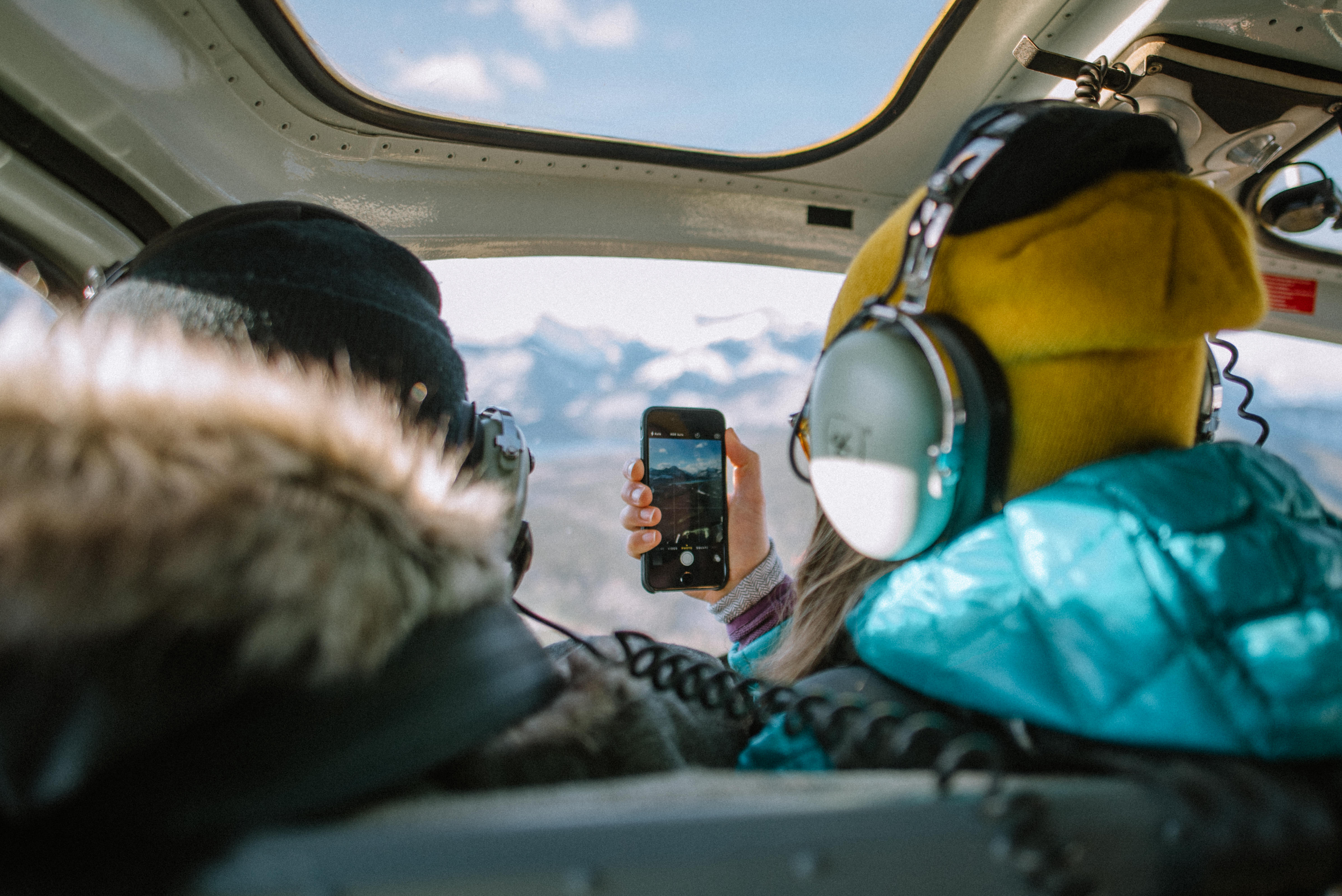 Looking through a helicopter window on a scenic winter tour in the Canadian Rockies