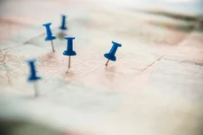 Close up of pushpins on roadmap route