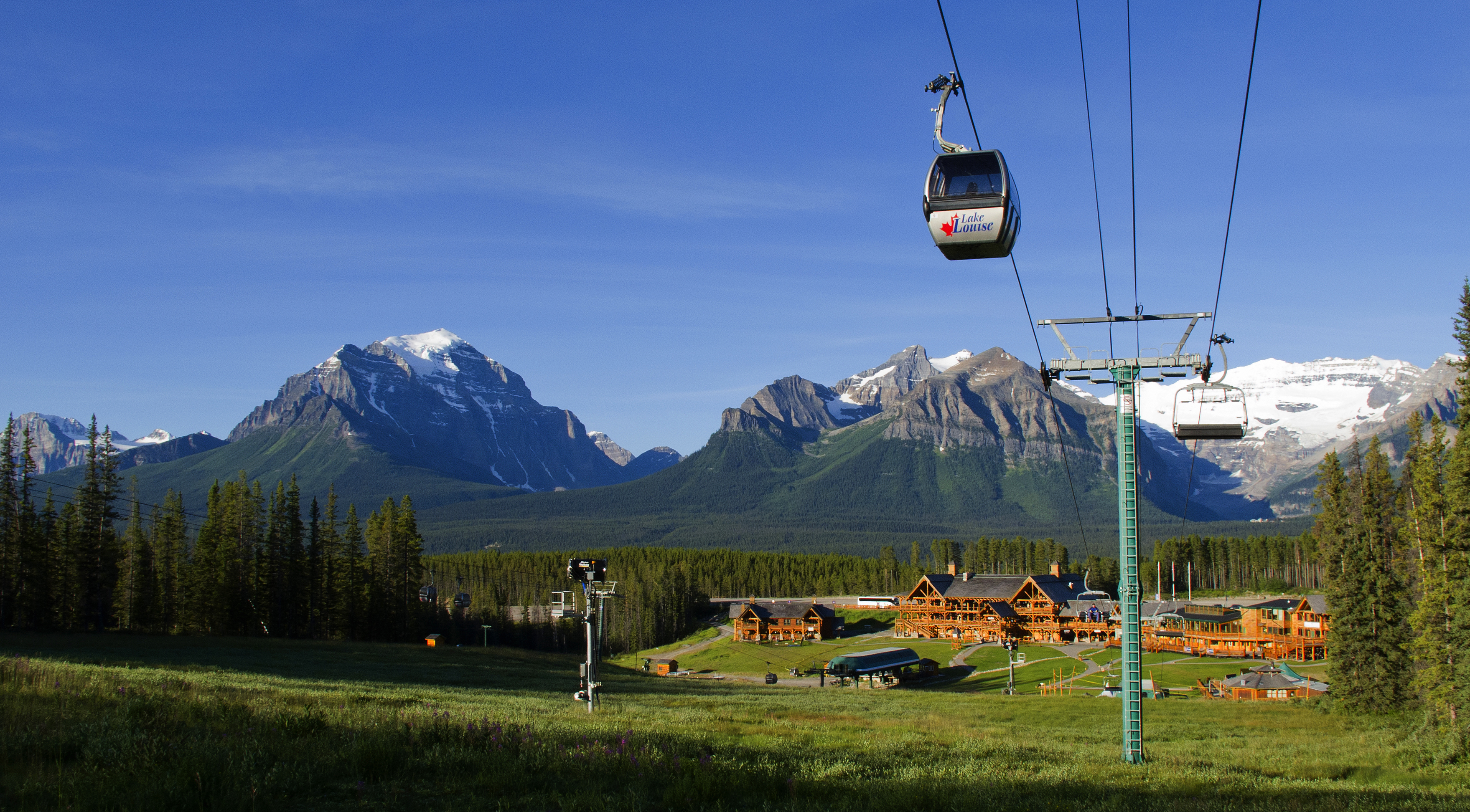 Lake Louise gondola above mountains and chalet buildings