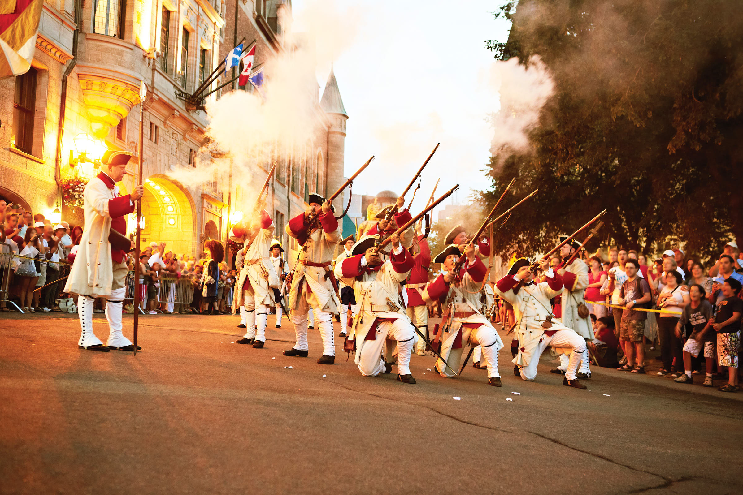 a band of costumed actors recreate a battle scene at the Holidays of New France Celebrations.