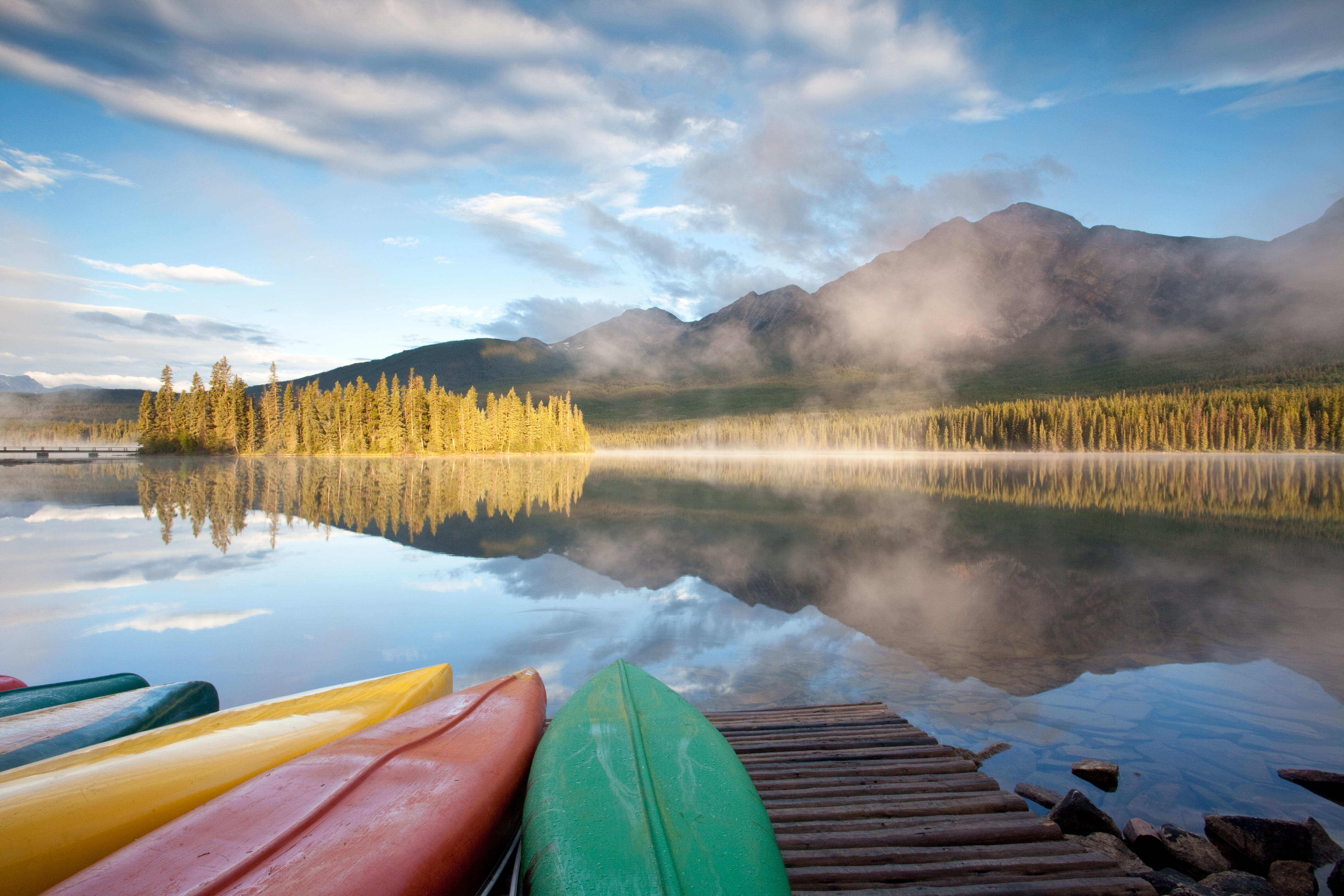 Kayaks lying on a dock next to Pyramid Lake and view of mountains in the distance 