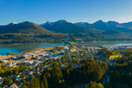 Aerial view of Juneau city and mountains on a sunny summer day