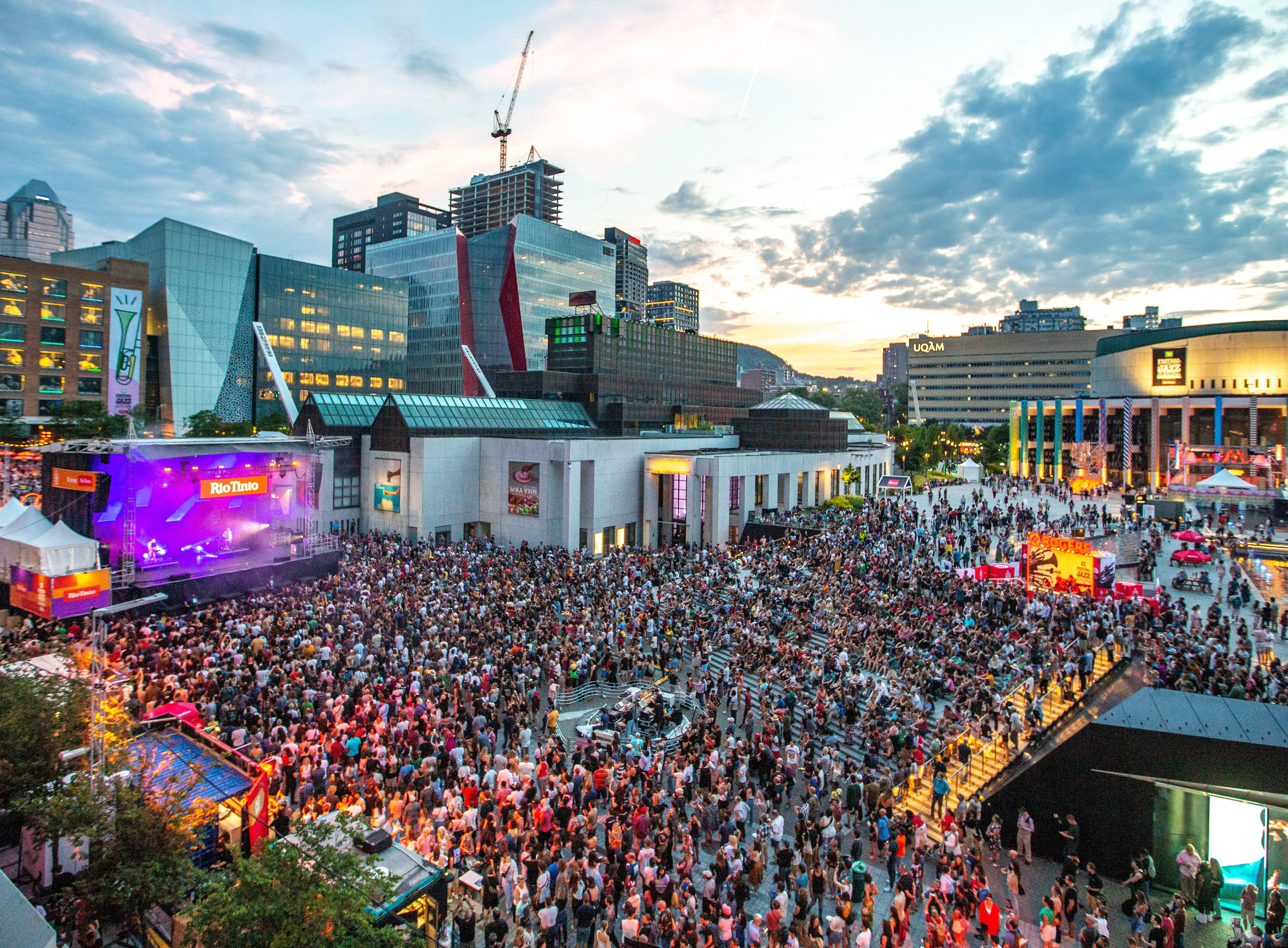 Aerial view of a crowd in downtown Montreal watching a performance at the Montreal Jazz Festival