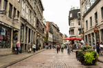 A view of the people walking down the cobblestone streets of Old Montreal