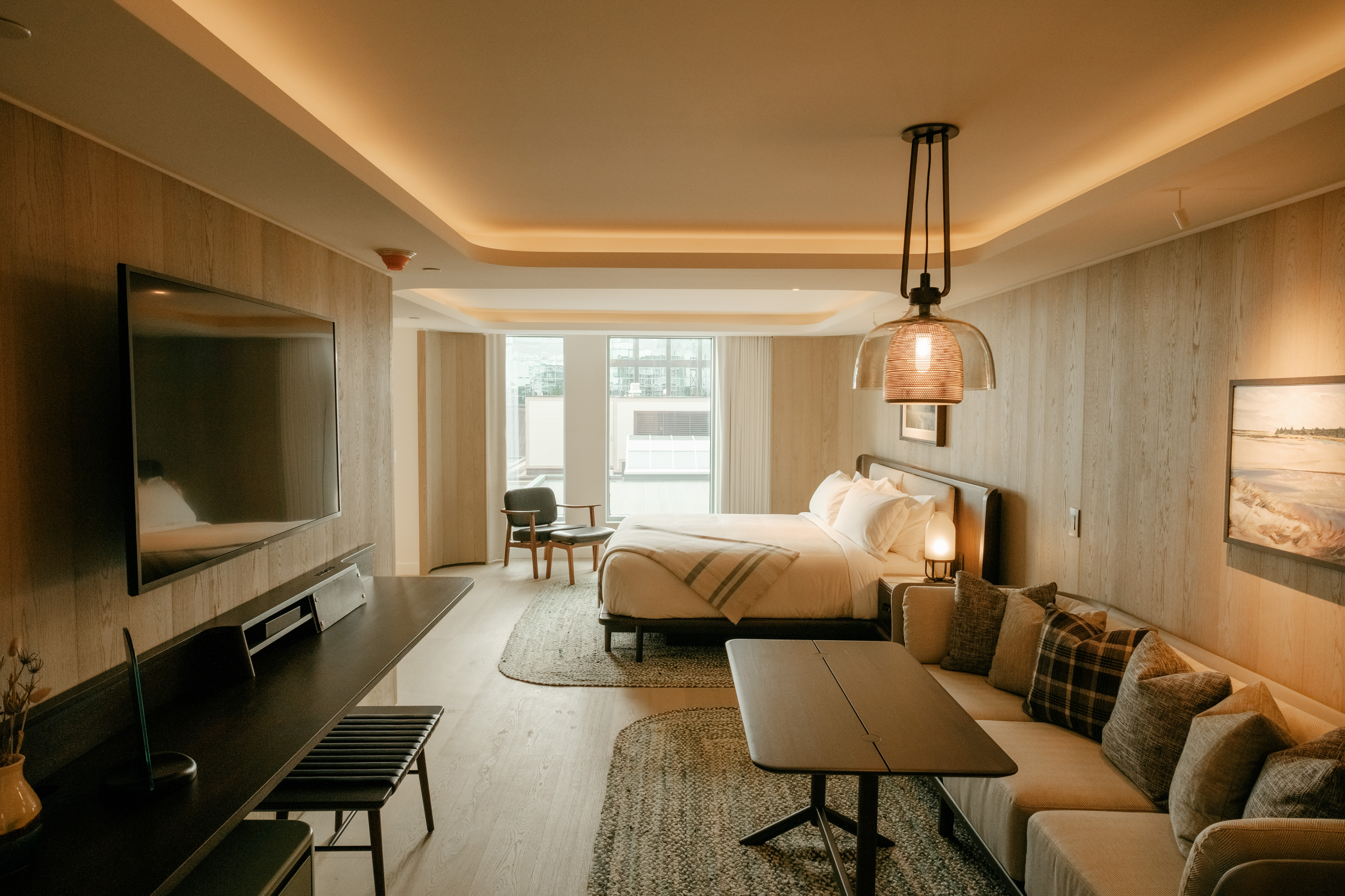 Contemporary room in the five-star Marriott Bonvoy, Muir, luxury hotel in Halifax with white oak walls and plank flooring