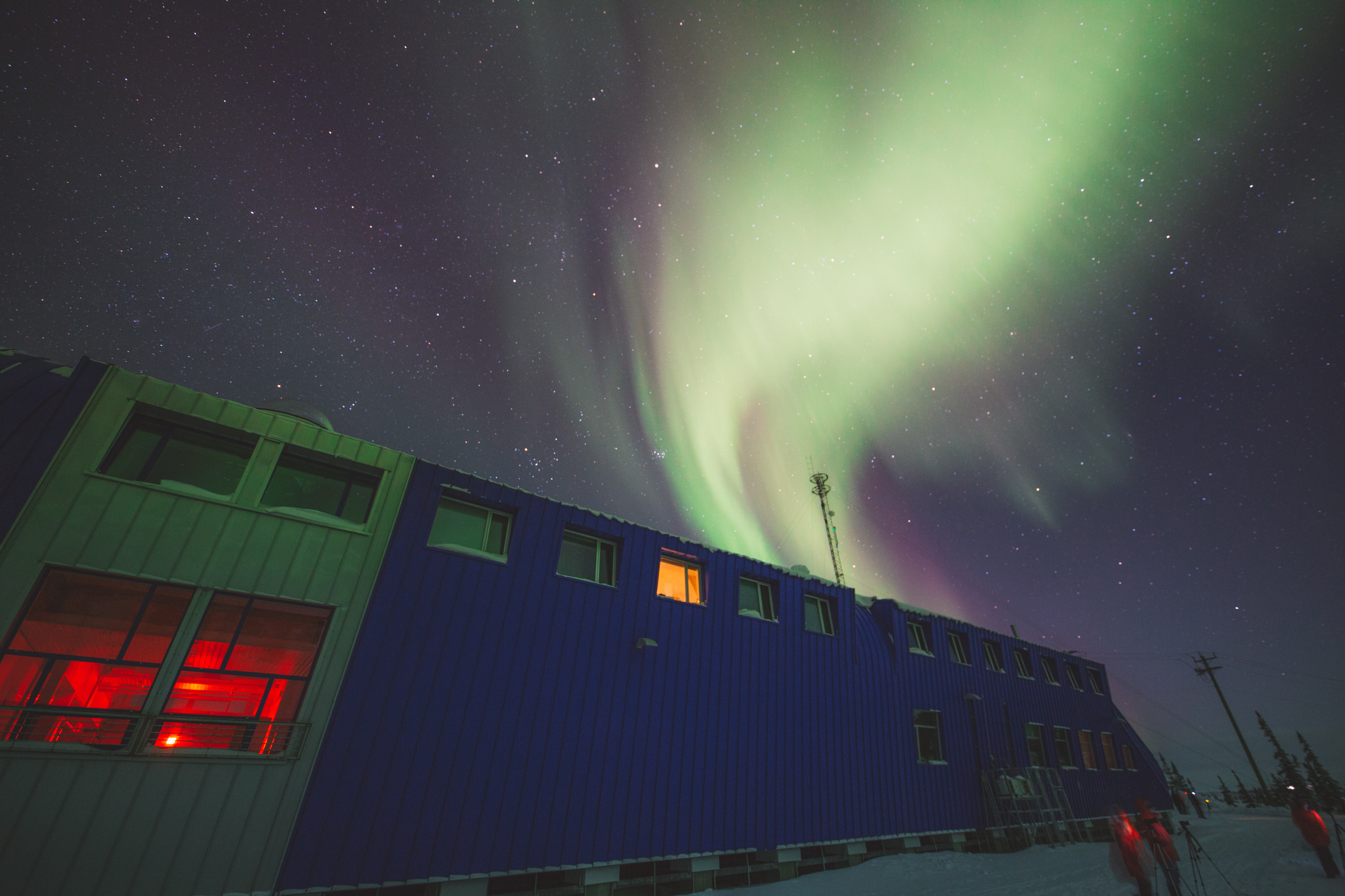 Exterior of the Churchill Northern Studies Centre with Northern Lights above