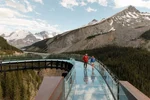 Two people are shown exploring the Columbia Icefield Skywalk